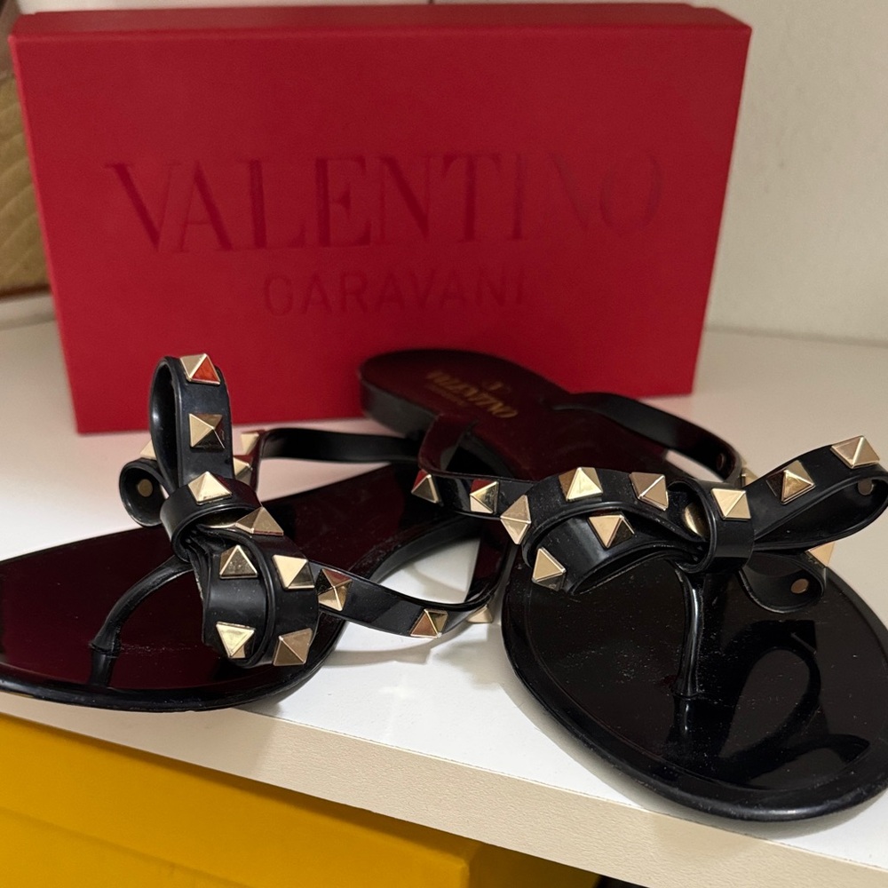 Valentino Garavani Black Jelly Bow Sandals with Gold Rockstuds